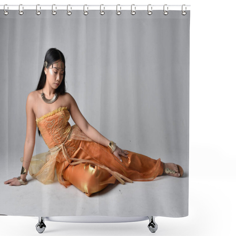 Personality  Full Length Portrait Of Pretty Young Asian Woman Wearing Golden Arabian Robes Like A Genie, Seated Pose, Isolated On Studio Background. Shower Curtains