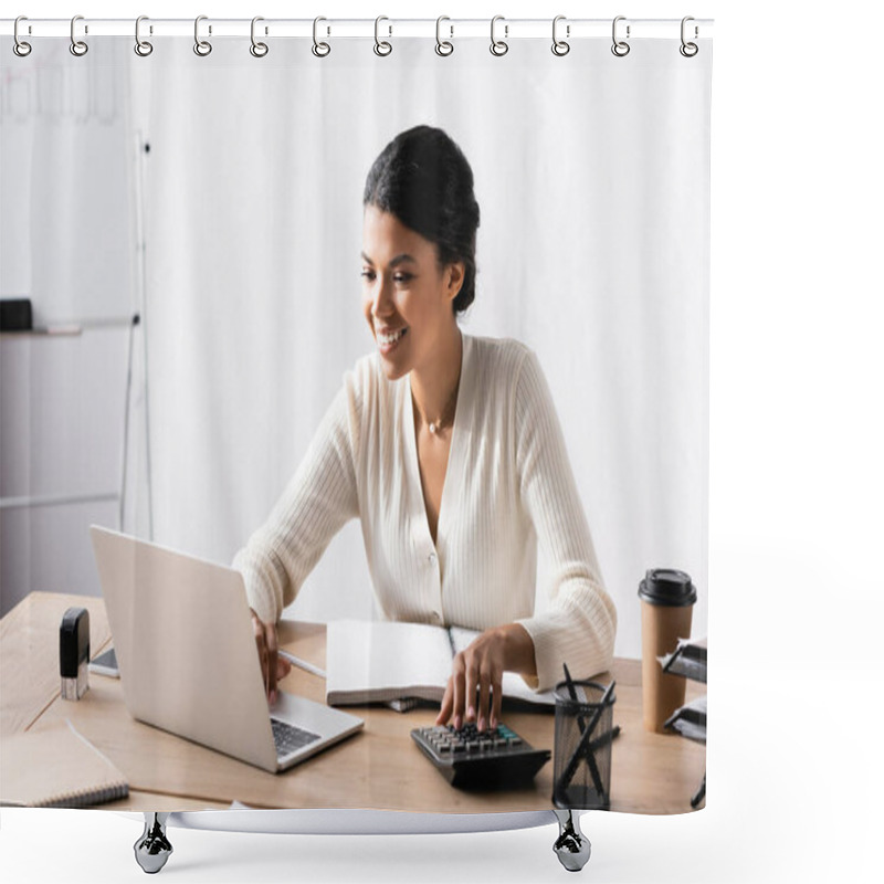 Personality  Happy African American Woman Looking At Laptop While Accounting On Calculator In Office On Blurred Background Shower Curtains