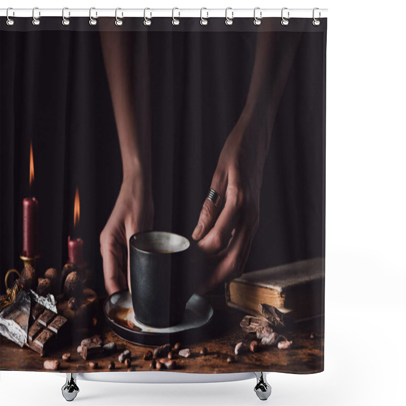 Personality  Cropped Shot Of Woman Holding Cup Of Coffee At Wooden Table With Chocolate, Truffles, Coffee Grains, Candles And Book On Black Background  Shower Curtains