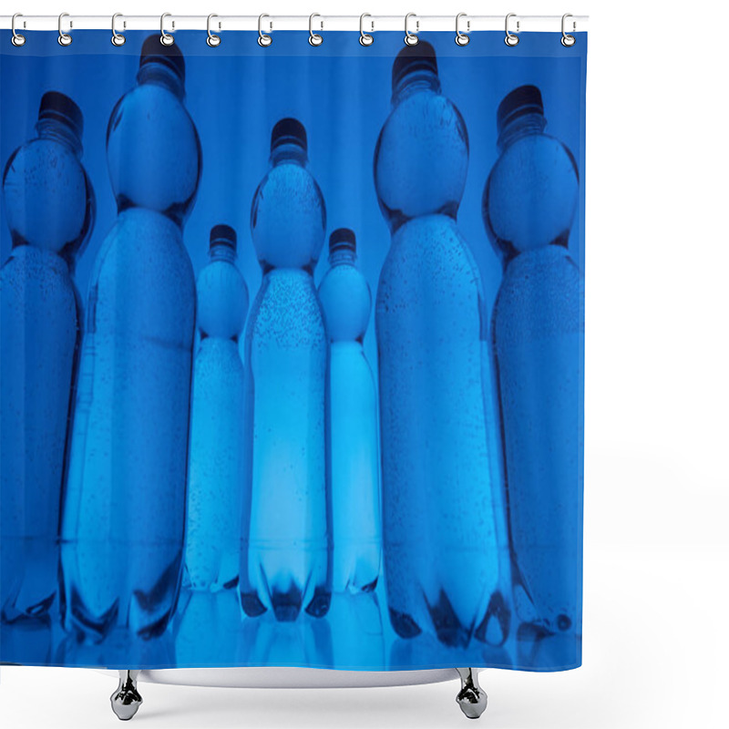 Personality  Toned Image Of Plastic Water Bottles In Rows On Neon Blue Background Shower Curtains