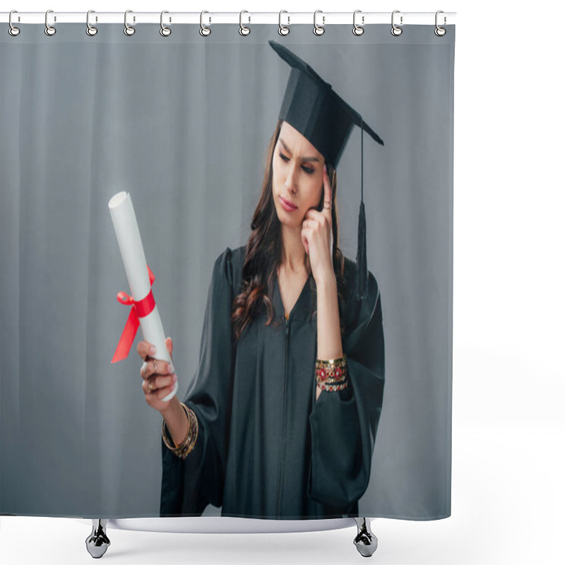 Personality  Thoughtful Indian Student In Academic Gown And Graduation Hat Looking At Diploma, Isolated On Grey Shower Curtains