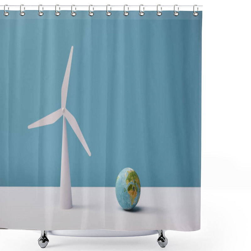 Personality  Small Globe And Windmill Model On White Table And Blue Background Shower Curtains