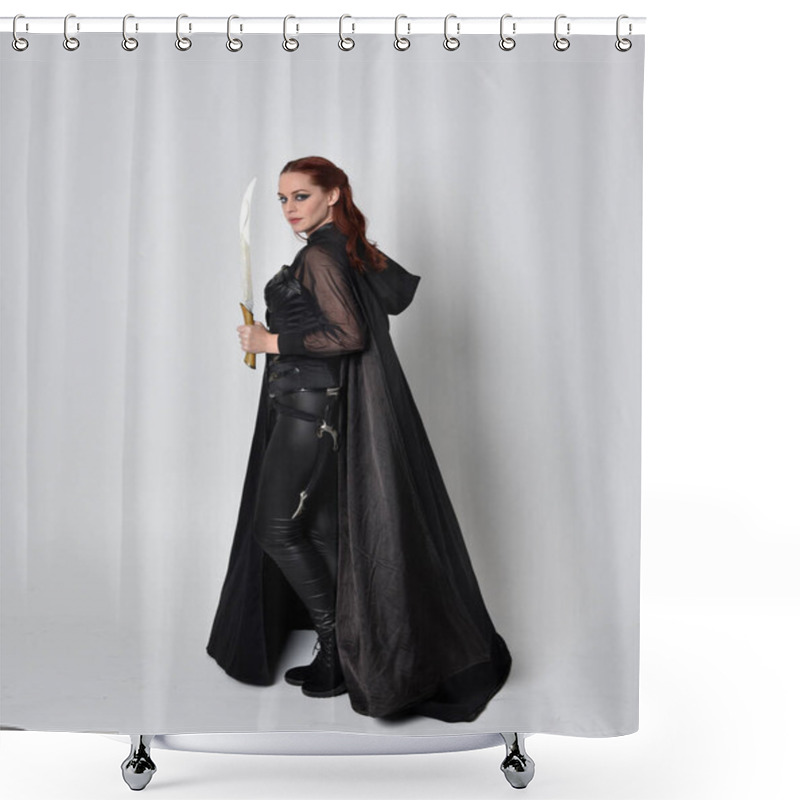 Personality  Fantasy Portrait Of A Woman With Red Hair Wearing Dark Leather Assassin Costume With Long Black Cloak. Full Length Standing Pose Holding A Sword Isolated Against A Studio Background. Shower Curtains