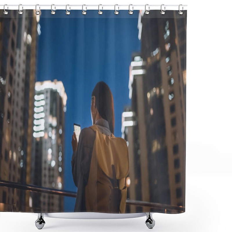 Personality  Back View Of Woman With Backpack And Smartphone With Map On Screen In Hands Standing On Night City Street Shower Curtains