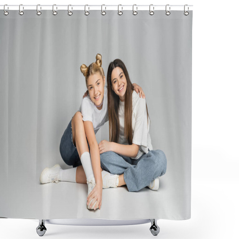 Personality  Smiling Blonde Teenage Girl In White T-shirt And Denim Shorts Hugging Girlfriend And Looking At Camera While Sitting On Grey Background, Lively Teenage Girls Concept, Friendship And Bonding Shower Curtains