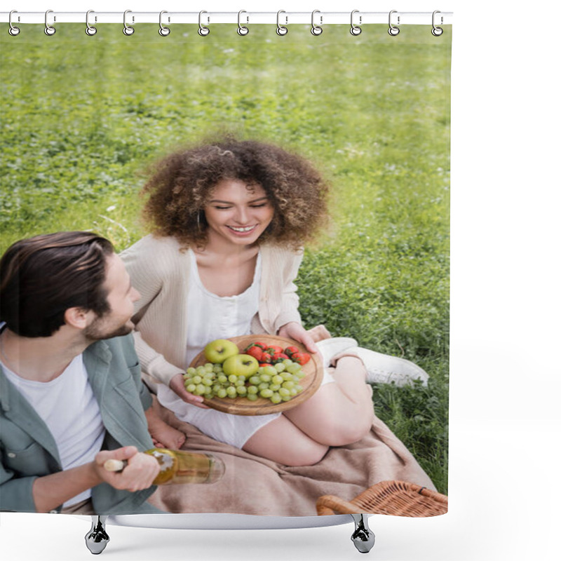 Personality  High Angle View Of Happy Man Holding Bottle Of Wine Near Curly Girlfriend Sitting With Cutting Board And Fruits Shower Curtains