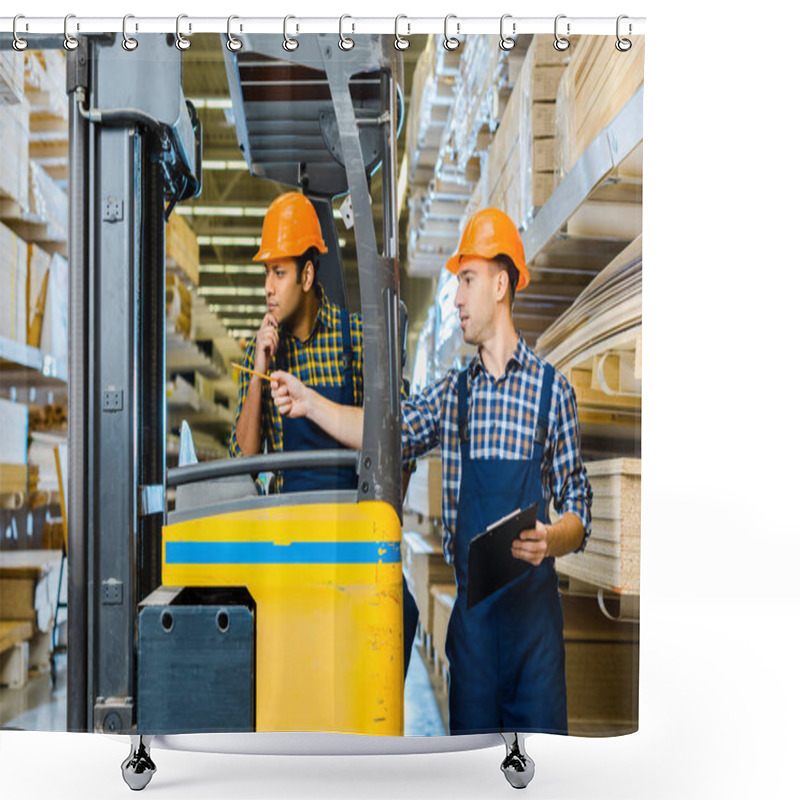 Personality  Indian Warehouse Worker Sitting In Forklift Machine Near Colleague Pointing With Pencil Shower Curtains