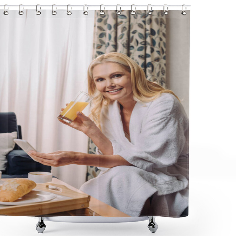 Personality  Mature Woman In Bathrobe Smiling At Camera While Drinking Juice And Using Smartphone In Hotel Room Shower Curtains