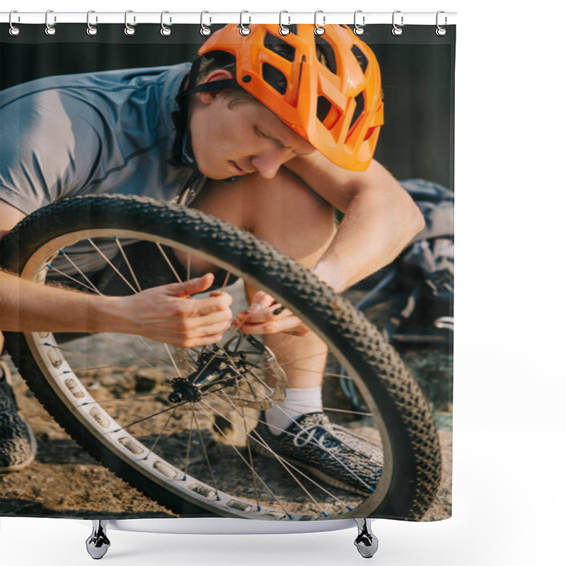 Personality  Close-up Shot Of Young Trial Biker Fixing Bicycle Wheel Outdoors Shower Curtains