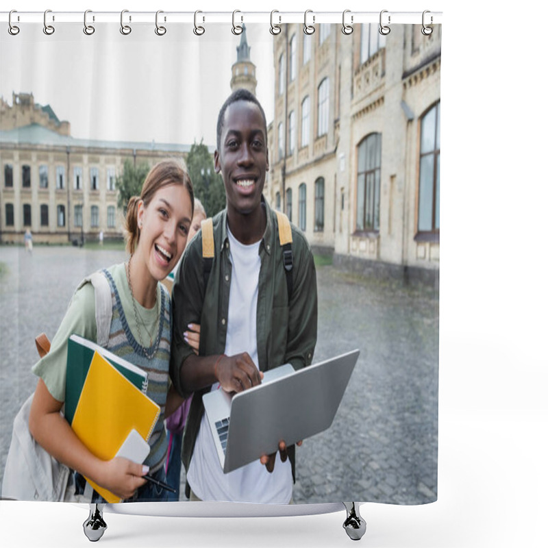 Personality  Smiling African American Student Holding Laptop Near Friend With Notebooks Outdoors  Shower Curtains