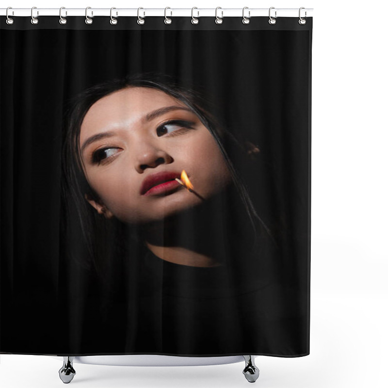 Personality  Portrait Of Pretty Asian Woman With Burning Match In Mouth Looking Away Isolated On Black Shower Curtains