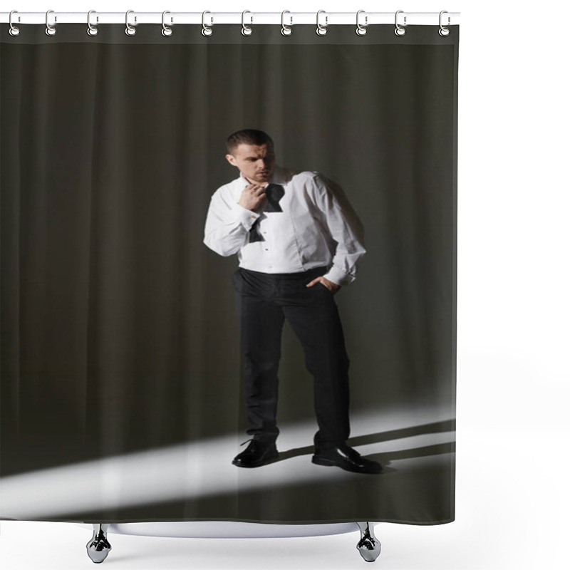 Personality  A Man In A White Shirt And Black Bow Tie Stands In A Beam Of Light, Adjusting His Collar. Shower Curtains