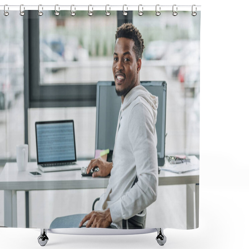 Personality  Cheerful African American Programmer Smiling At Camera While Sitting At Workplace In Office Shower Curtains