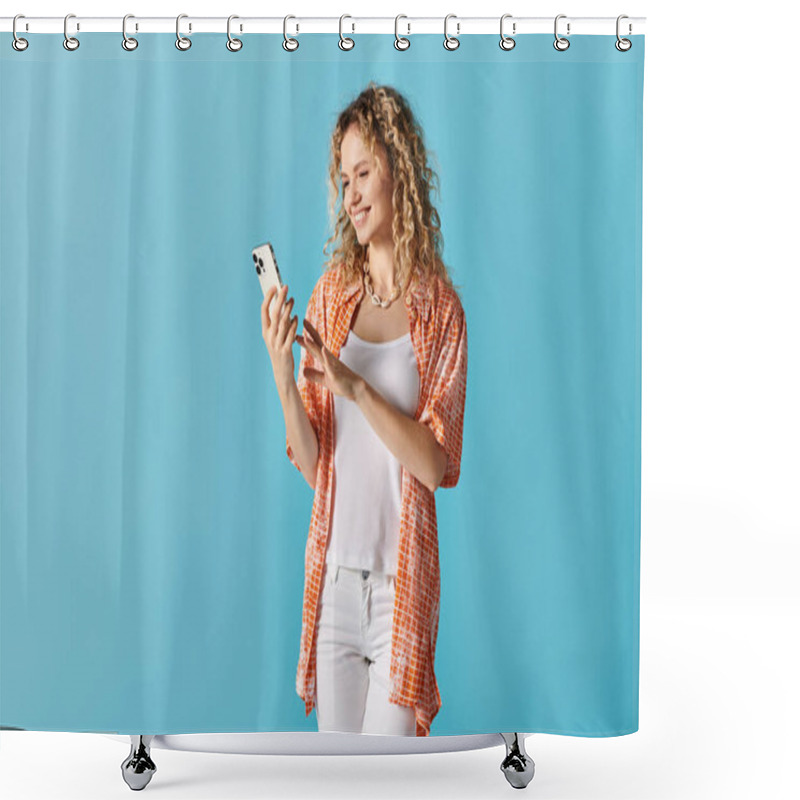 Personality  Young Woman With Curly Hair Using A Cell Phone On Blue Background. Shower Curtains