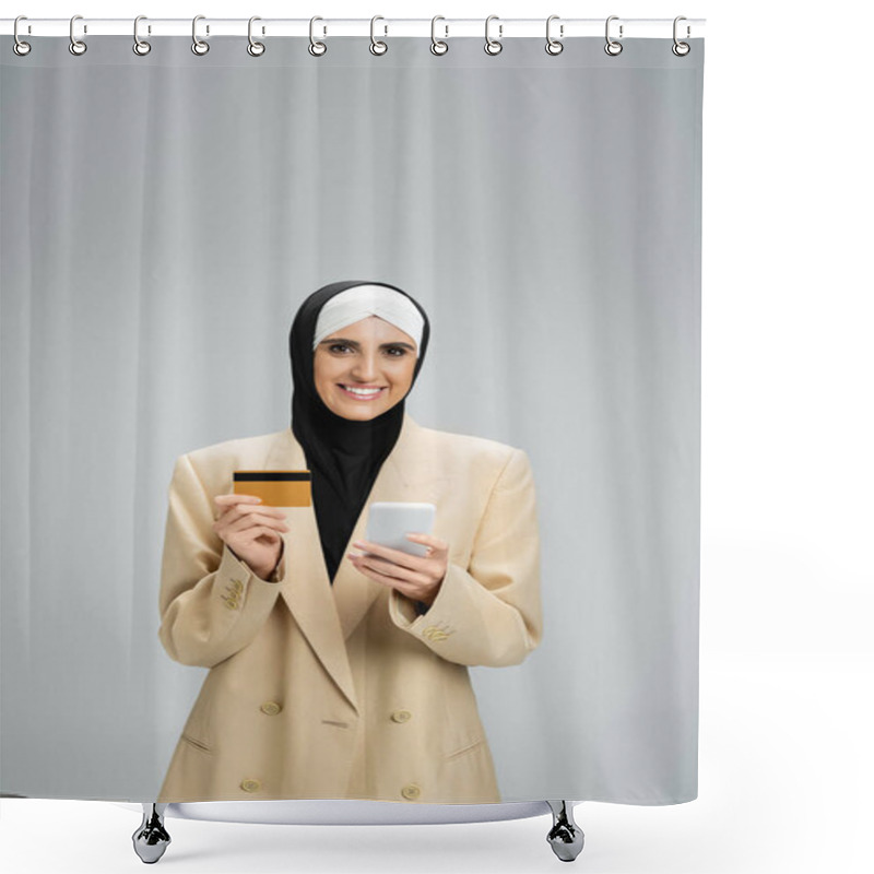 Personality  Cheerful Muslim Businesswoman In Hijab And Trendy Blazer Holding Smartphone And Credit Card On Grey Shower Curtains