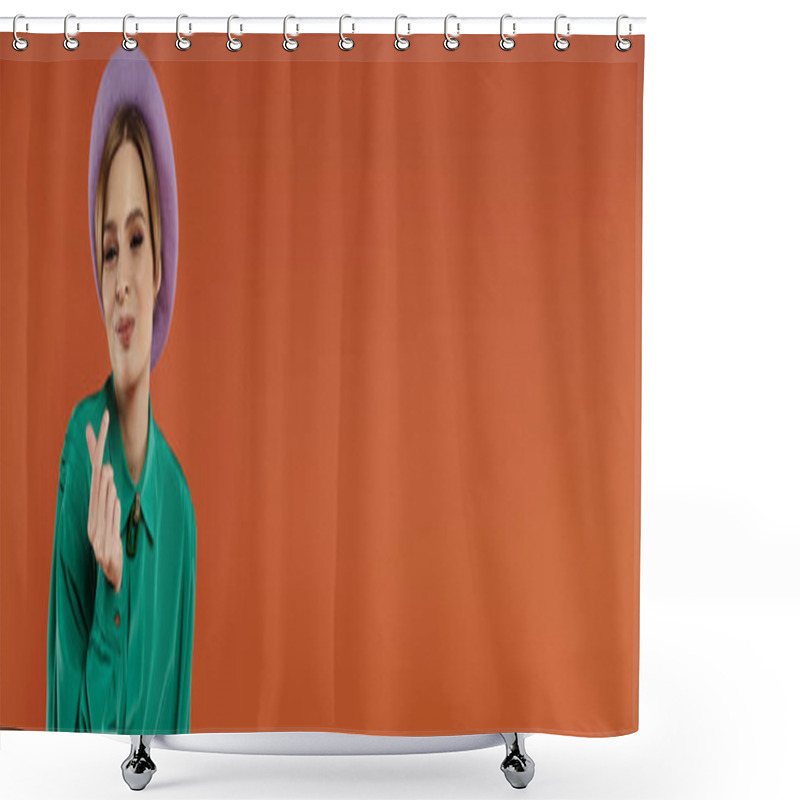 Personality  A Woman In A Green Shirt And Purple Beret Poses Confidently Against A Bright Orange Background. Shower Curtains