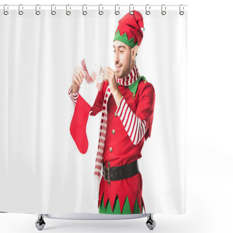 Personality  Man In Christmas Elf Costume Putting Present In Red Christmas Stocking Isolated On White Shower Curtains