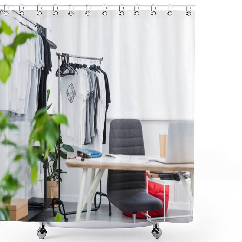 Personality  Selective Focus Of T-shirts On Hangers And Working Table With Laptop In Clothing Design Studio Shower Curtains