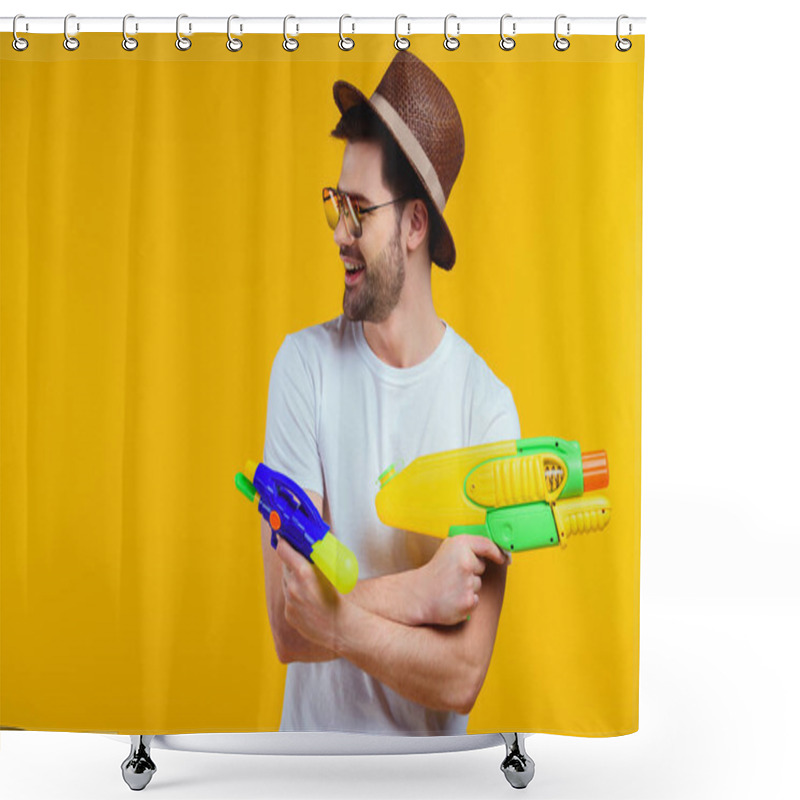 Personality  Smiling Young Man In Hat And Sunglasses Playing With Water Guns Isolated On Yellow Shower Curtains