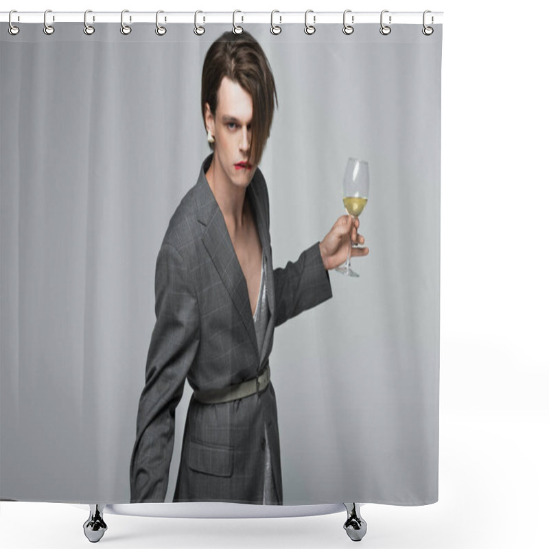 Personality  Young Transgender Man In Blazer Biting Lip While Holding Glass Of Wine Isolated On Grey Shower Curtains