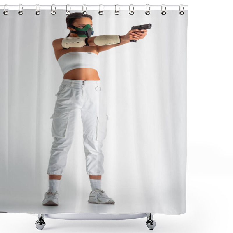 Personality  Futuristic African American Woman In Safety Mask Aiming Gun On White Background Shower Curtains