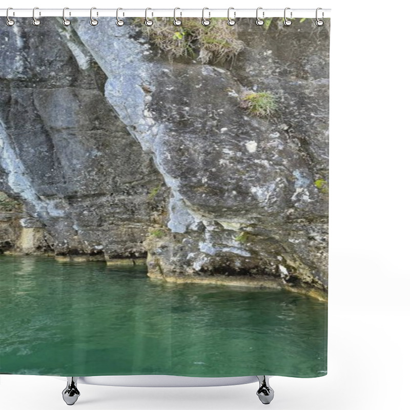 Personality  Cliff Face Of Bavarian Alps With Lush Plants Above Emerald Waters Of Lake Koenigsee. A Rocky Cliff Face Covered In Vegetation Above A Emerald Lake Showcasing Natural Beauty Of Bavaria, Germany. Evokes Shower Curtains