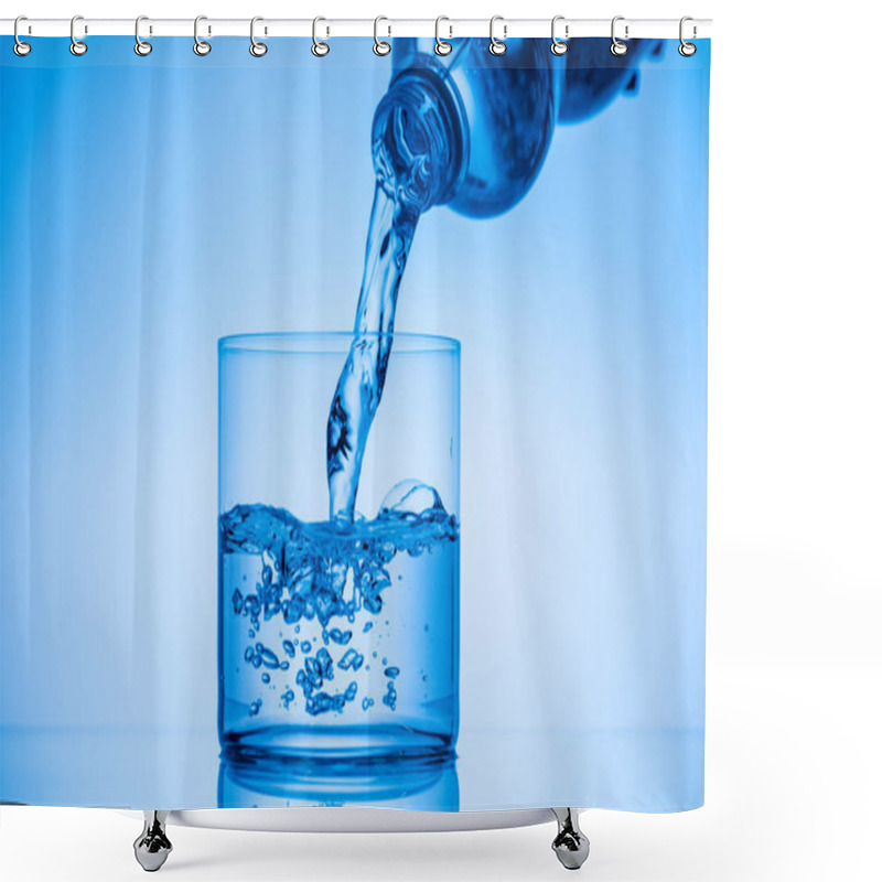 Personality  Water Pouring From Plastic Bottle In Drinking Glass On Blue Background Shower Curtains