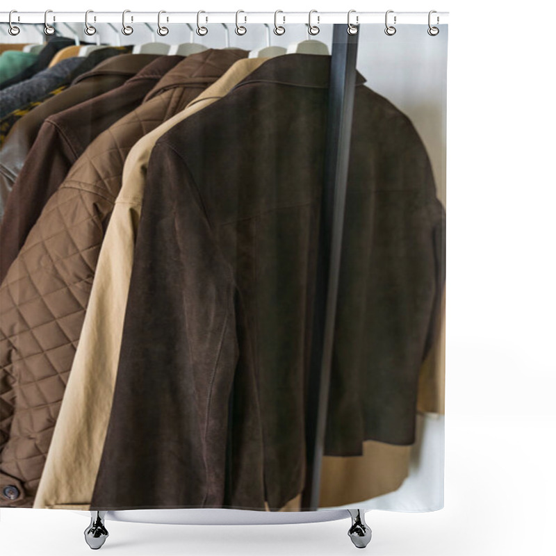 Personality  A Close-up Shot Of Elegant Autumn And Winter Coats In Shades Of Brown And Beige Hanging On A Sleek Metal Clothing Rack. The Collection Includes Suede, Quilted, And Leather Materials, Modern Fashion Shower Curtains