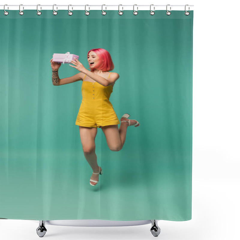 Personality  Full Length Of Cheerful Young Woman With Pink Dyed Hair Jumping And Catching Present On Blue  Shower Curtains