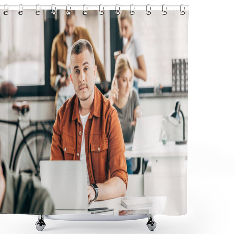 Personality  Handsome Young Man Working With Laptop At Open Space Office And Looking At Camera With Colleagues On Background Shower Curtains