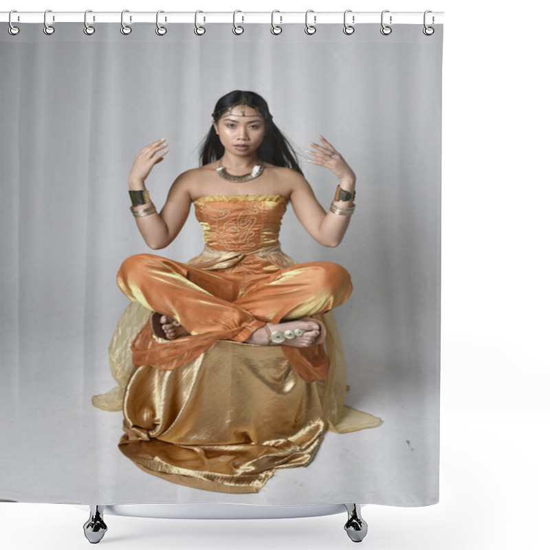 Personality  Full Length Portrait Of Pretty Young Asian Woman Wearing Golden Arabian Robes Like A Genie, Seated Pose, Isolated On Studio Background. Shower Curtains