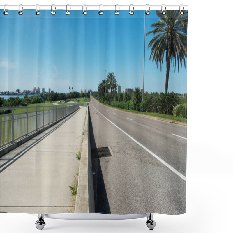 Personality  Bridge And Empty Road Across The Clearwater River And View Of The Beach With Buildings And Pier Under Blue Skies. Shower Curtains