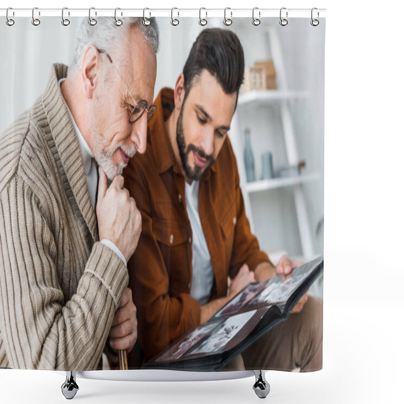 Personality  Handsome Bearded Man And Senior Father In Glasses Looking At Photo Album  Shower Curtains