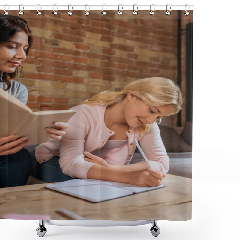 Personality  Selective Focus Of Woman Holding Book While Kid Writing On Notebook On Coffee Table At Home  Shower Curtains