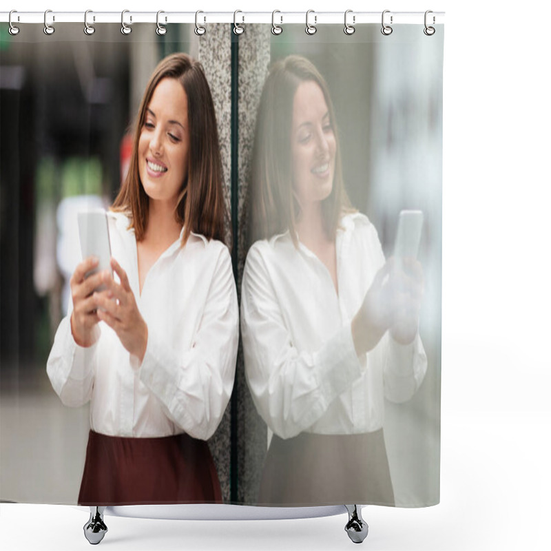 Personality  A Young Woman In A Stylish White Blouse And Brown Skirt Smiles While Using Her Smartphone In A Sleek Corporate Office Space. She Appears Engaged And Focused On Her Task. Shower Curtains