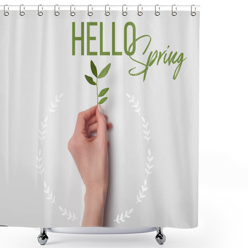 Personality  Top View Of Female Hand With Tea Plant Branch And Hello Spring Lettering On White Background Shower Curtains