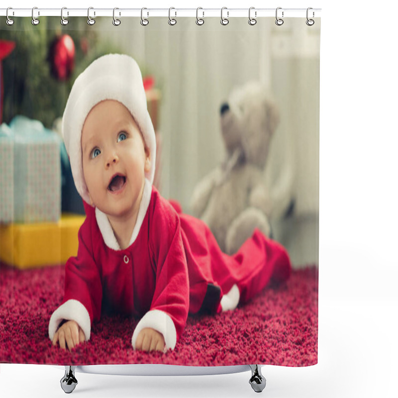 Personality  Close-up Portrait Of Adorable Little Baby In Santa Hat With Blurred Christmas Tree And Gifts On Background And Looking Up Shower Curtains