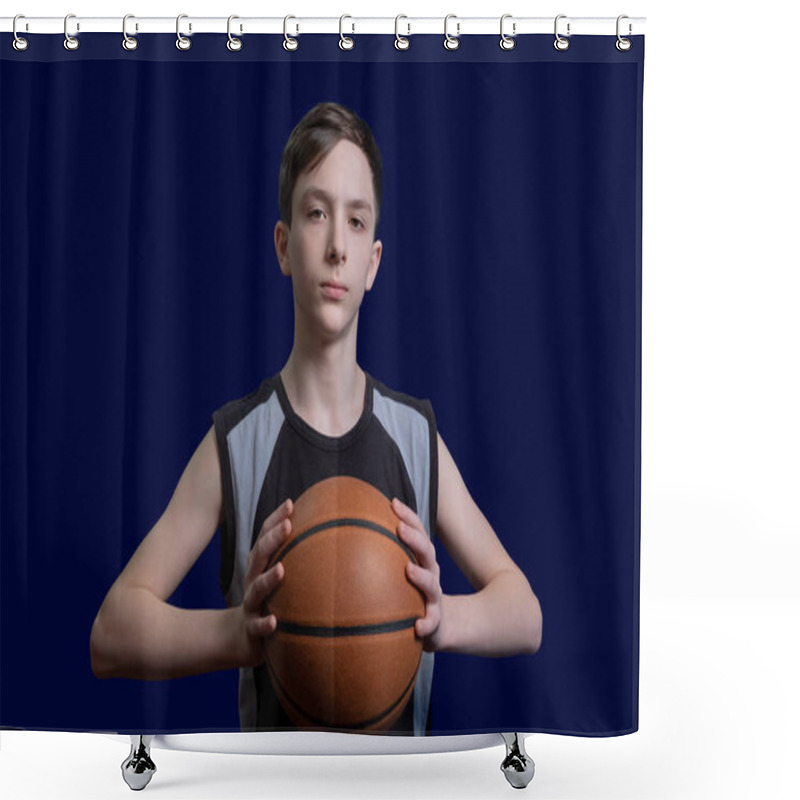 Personality  Portrait Of A Teen Basketball Player. The Guy In The Black T-shirt Holds The Ball In His Hands. The Concept Of A Sports Poster Or Design News About Basketball Competitions. Isolated On Blue Background. Shower Curtains