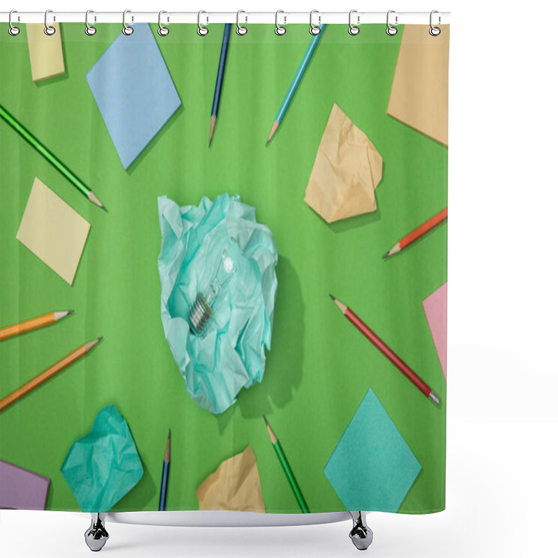 Personality  Top View Of Light Bulb On Piece Of Crumpled Paper Near Scattered Paper And Pencils On Green Shower Curtains