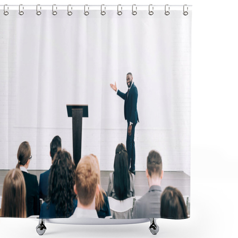 Personality  Smiling African American Lecturer Talking To Audience During Seminar In Conference Hall And Pointing On Screen Shower Curtains