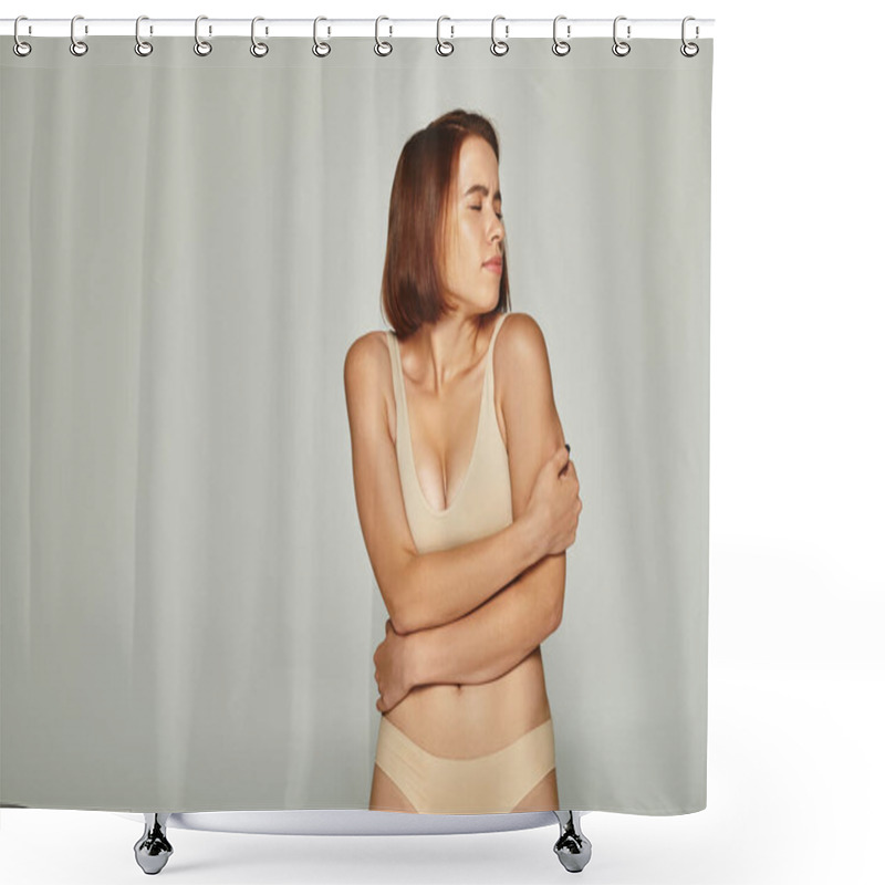 Personality  Concerned Young Woman In Beige Underwear Looking Over Shoulder On Grey Background, Vulnerability Shower Curtains