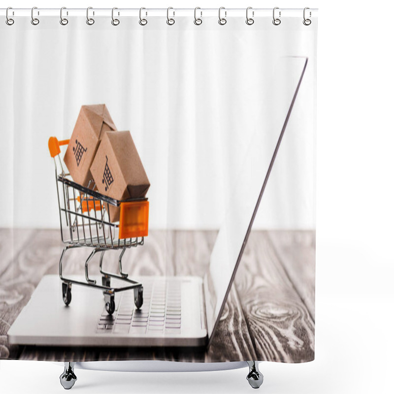 Personality  Selective Focus Of Toy Shopping Cart With Small Carton Boxes On Laptop Isolated On White, E-commerce Concept Shower Curtains