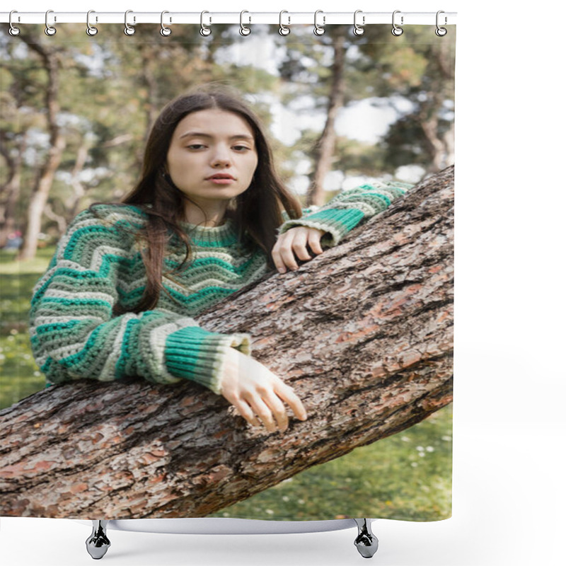 Personality  Young Brunette Woman In Sweater Looking At Camera Near Tree Trunk In Summer Park  Shower Curtains