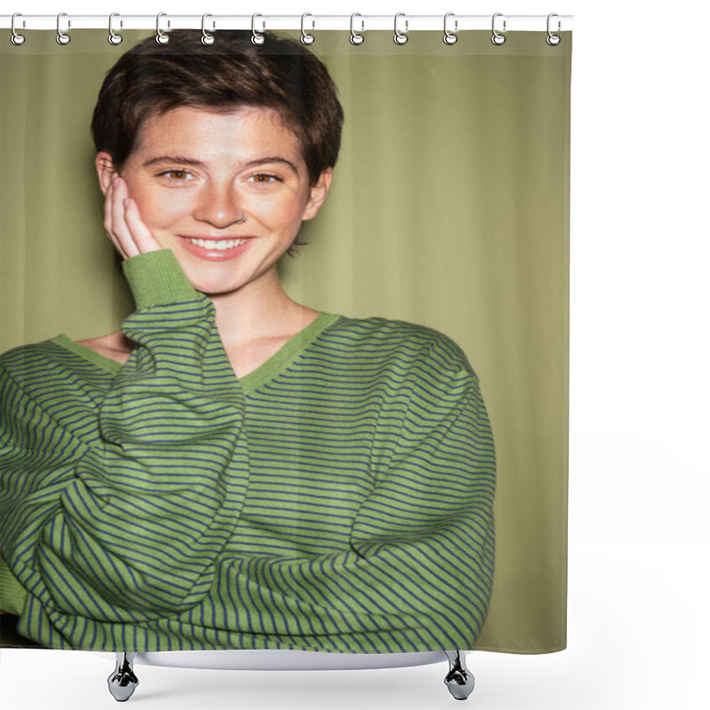 Personality  Portrait Of Joyful Brunette Woman In Striped Pullover Touching Face And Looking At Camera On Green Background Shower Curtains