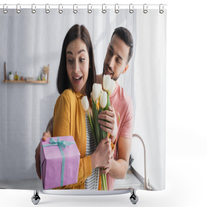 Personality  Young Man Hugging Excited Girlfriend And Presenting Bouquet Of Flowers And Gift Box In Kitchen Shower Curtains