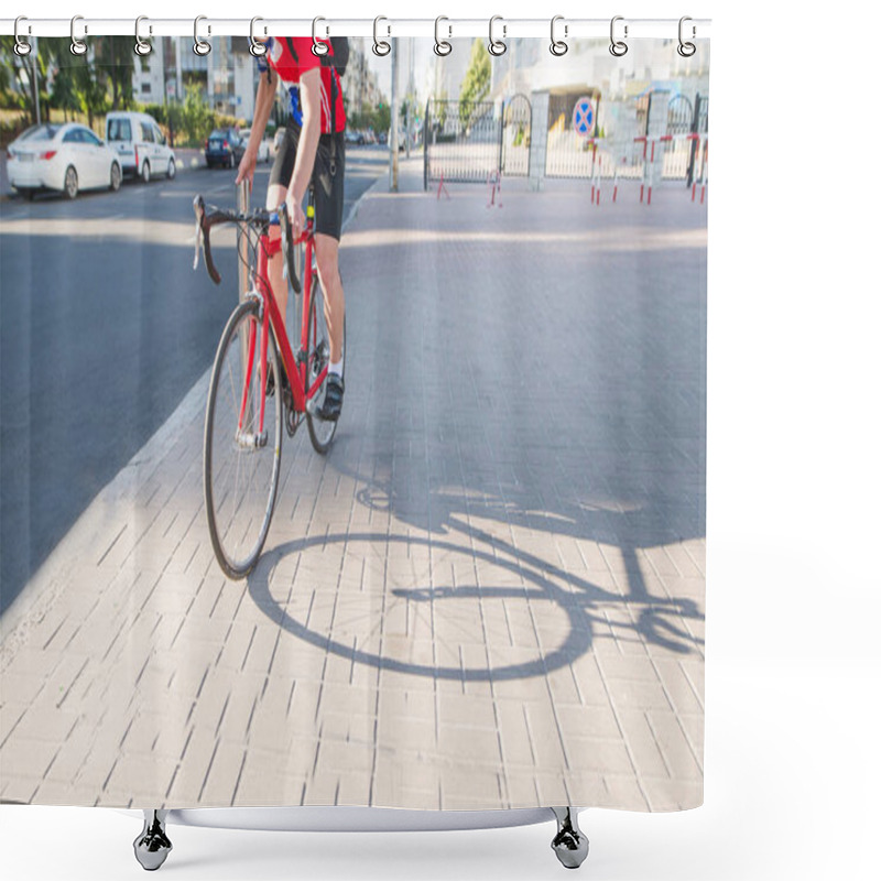 Personality  Professional Cyclist In Red Sportswear Is Standing On A Red Bicycle On The Sidewalk. Portrait Racing Driver Of A Cyclist. Sports Concept. Shower Curtains