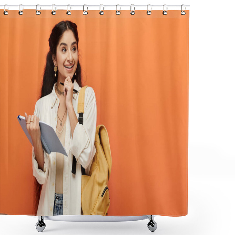 Personality  Young Indian Woman Holding A Notebook In Front Of An Orange Wall. Shower Curtains