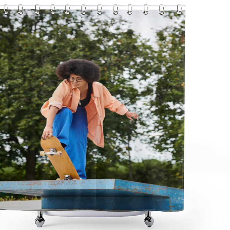 Personality  A Young African American Woman With Curly Hair, Wearing Blue Pants And An Orange Shirt, Executes A Trick On A Skateboard At A Vibrant Skate Park. Shower Curtains