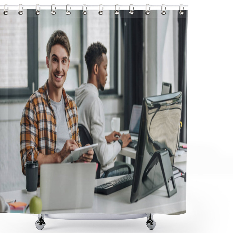 Personality  Cheerful Young Programmer Smiling At Camera While Sitting Near African American Colleague And Using Digital Tablet Shower Curtains