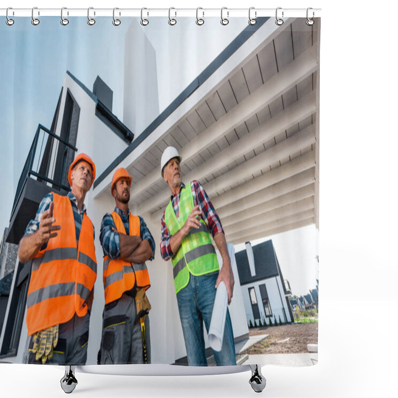 Personality  Low Angle View Of Constructors In Helmets Standing Near Coworker With Blueprint  Shower Curtains